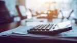 close-up-calculator-business-working-desk-dark-background