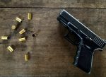 empty-bullets-gun-table