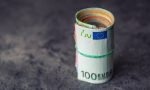 euro-banknotes-euro-currency-euro-money-close-up-rolled-euro-banknotes-concrete-wooden-table