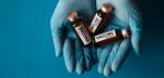 ands-latex-gloves-holding-vials-new-coronavirus-vaccine-close-up-blue-background-medics-scientists-against-covid-19-pandemic-medicine-ready-test-volunteers-copy-space