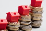 housing-cost-red-house-with-british-currency