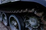 view-front-part-green-caterpillar-tank-standing-ground-with-wheels