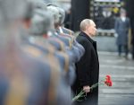 Vladimir Putin attends a wreath-laying ceremony at the Tomb of the Unknown Soldier