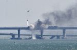 Parts of Crimea bridge collapse following fire