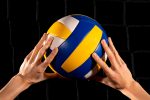 Photo hands playing volley ball