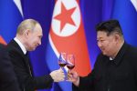 Two polititian drink wine