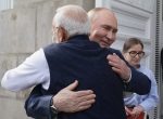 Russian President Vladimir Putin and Indian Prime Minister Narendra Modi embrace each other