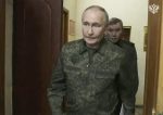 Russian President Vladimir Putin, accompanied by Russian Chief of General Staff Gen. Valery Gerasimov, during a visit to military headquarters in the Kursk region