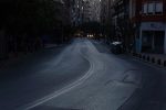 A darkened street is seen empty during a power outage