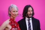 Canadian actor Keanu Reeves (R) and artist Alexandra Grant (L)