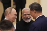 Indian Prime Minister Narendra Modi talks with Russian President Vladimir Putin and Chinese President Xi Jinping (