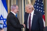 US President Donald Trump (R) shakes hands with Israeli Prime Minister Benjamin Netanyahu