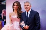 Amal Clooney (L) and US actor George Clooney