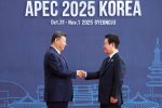 South Korean President Lee Jae Myung shakes hands with Chinese President Xi Jinping