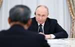 Russian President Vladimir Putin attends a meeting with Chinese Premier Li Qiang