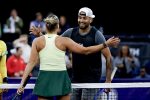 Aryna Sabalenka (L) of Belarus in action against Nick Kyrgios