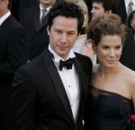 Sandra Bullock (R), and actor Keanu Reeves