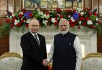 Russian President Vladimir Putin and Indian Prime Minister Narendra Modi shake hands