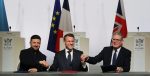 Ukraine's President Volodymyr Zelensky, France's President Emmanuel Macron and Britain's Prime Minister Keir Starmer shake hands