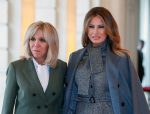 Brigitte Macron (L) welcomes US First Lady Melania