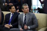 US Secretary of State Marco Rubio (L) and Secretary of Defense Pete Hegseth (R) attend bilateral meeting between US President Donald Trump