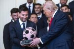 Inter Miami forward Lionel Messi (L) gives US President Donald Trump (R) a gift