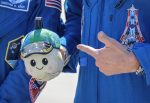 Artemis II mission commander NASA Reid Wiseman holds the mission's 'moon mascot'