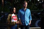 Prince Harry (R) and Meghan