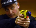 policeman demonstrates a new US-style stun gun