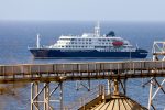 Dutch cruise ship MV Hondius is anchored off the coast of the city of Praia on the island of Santiago, Cape Verde, 04 May 2026, after three people died onboard from an acute respiratory syndrome