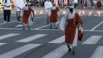 Humanoid robots (front) dressed as Buddhist monks