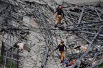 section of a collapsed building, in a residential district of Angeles City, Pampanga province, Philippines,