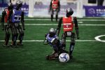 Humanoid robots play a football match d