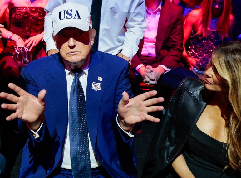 US President Donald Trump (L) gestures next to first lady Melania Trump (R