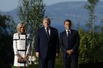 French President Emmanuel Macron (R) and his wife Brigitte Macron (L) welcome US President Donald J. Trump