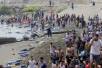 Hundreds of migrants swim across to Ceuta from Morocco