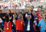 Spain's head coach Luis de la Fuente lifts the World Cup trophy
