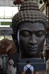 Visitors view a Buddha
