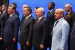 Chinese President Xi Jinping, Kyrgyz President Sadyr Japarov, Russian President Vladimir Putin, Togolese Prime Minister Faure Gnassingbe, Pakistani Prime Minister Shehbaz Sharif and Armenian Prime Minister Nikol Pashinyan pose for a group photo