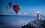hot air baloons lighthouse pixabay