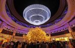 Tourists from Chinese mainland watch a 'Tree of Prosperity'