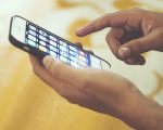 person holding phone pixabay